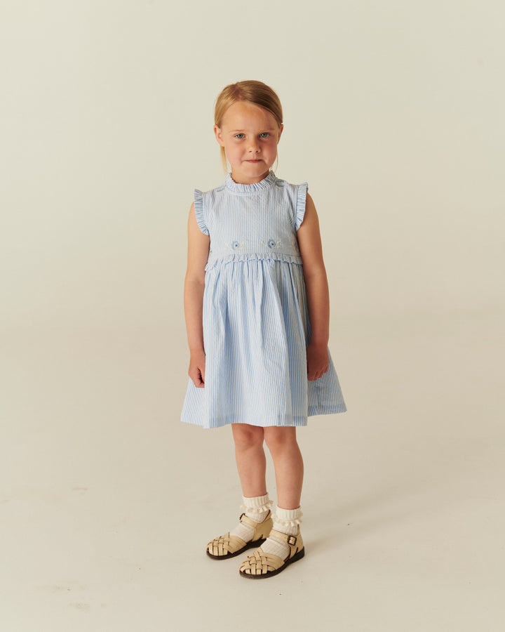 SEERSUCKER DRESS W. RUFFLES AND EMB. - SKY BLUE W CREAM STRIPE