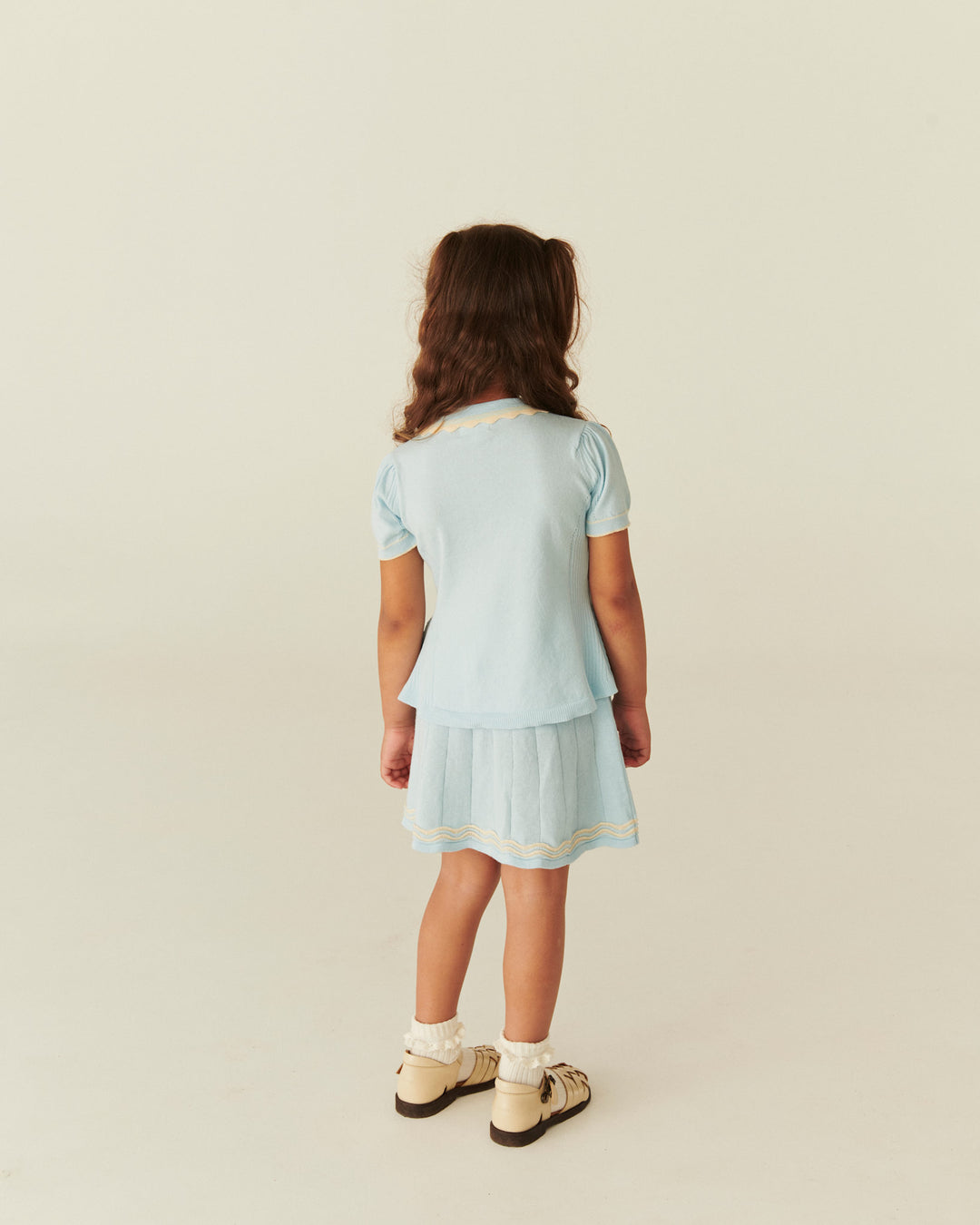KNITTED PEPLUM BLOUSE - ICE BLUE/CREAM COMB.