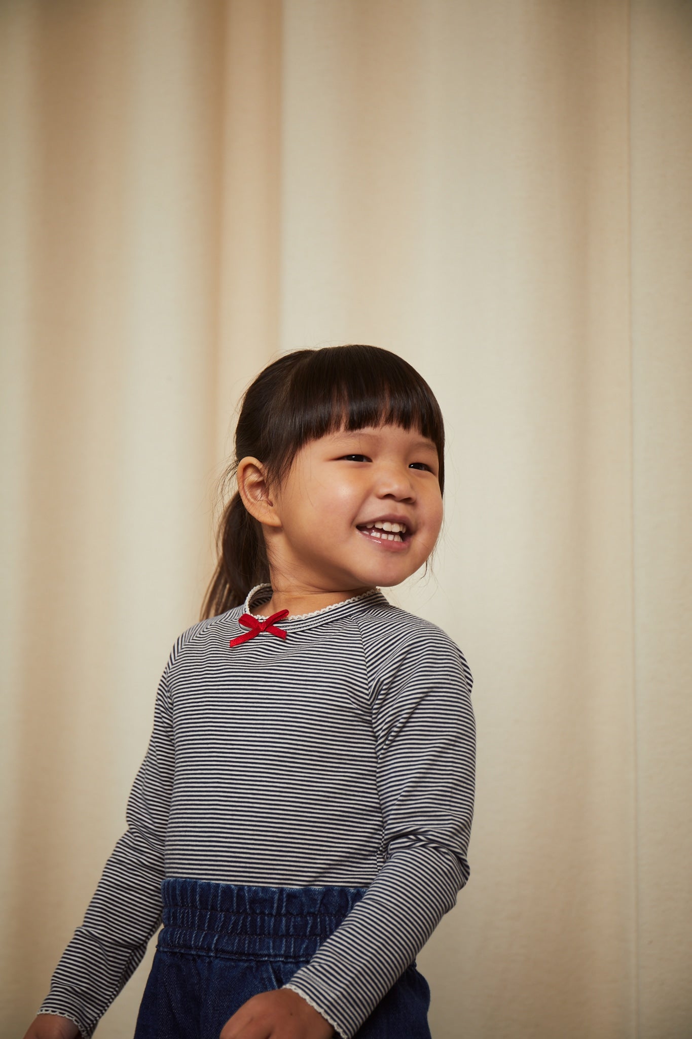 STRIPED LS TEE W. BOW - NAVY/CREAM STRIPE