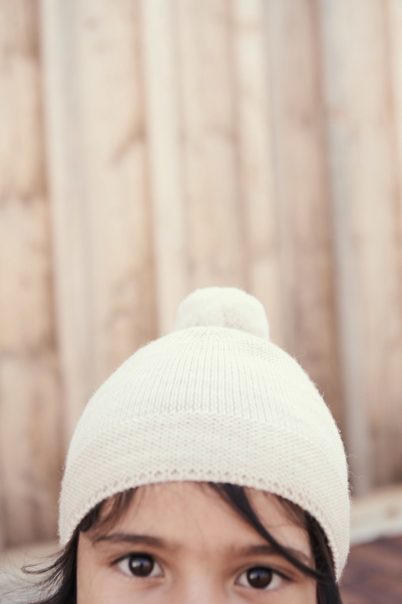 KNITTED BEANIE WITH POMPOM - PALE CREAM MELANGE